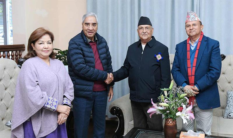 Former president of Nepali Congress Sher Bahadur Deuba shaking hand with Chairman of the CPN UML KP sharma Oli