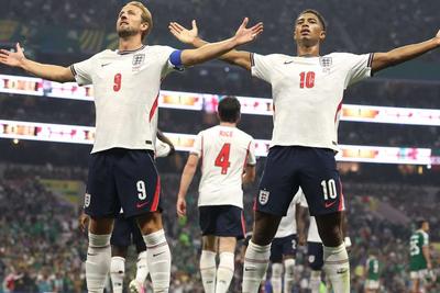 Harry kane and Jude Bellingham celebrating after win